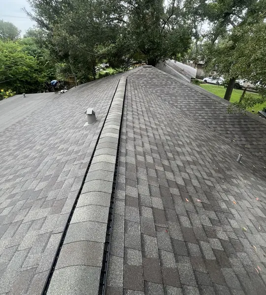 Hip ridge of an October 2024 roof replacement in Spring Branch