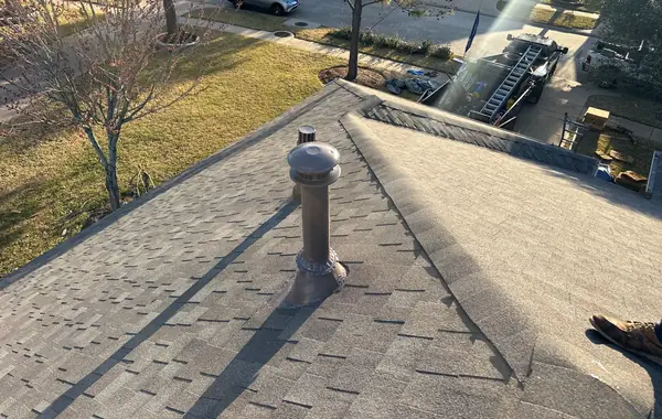 Painted chimney with new flashing on the completed roof