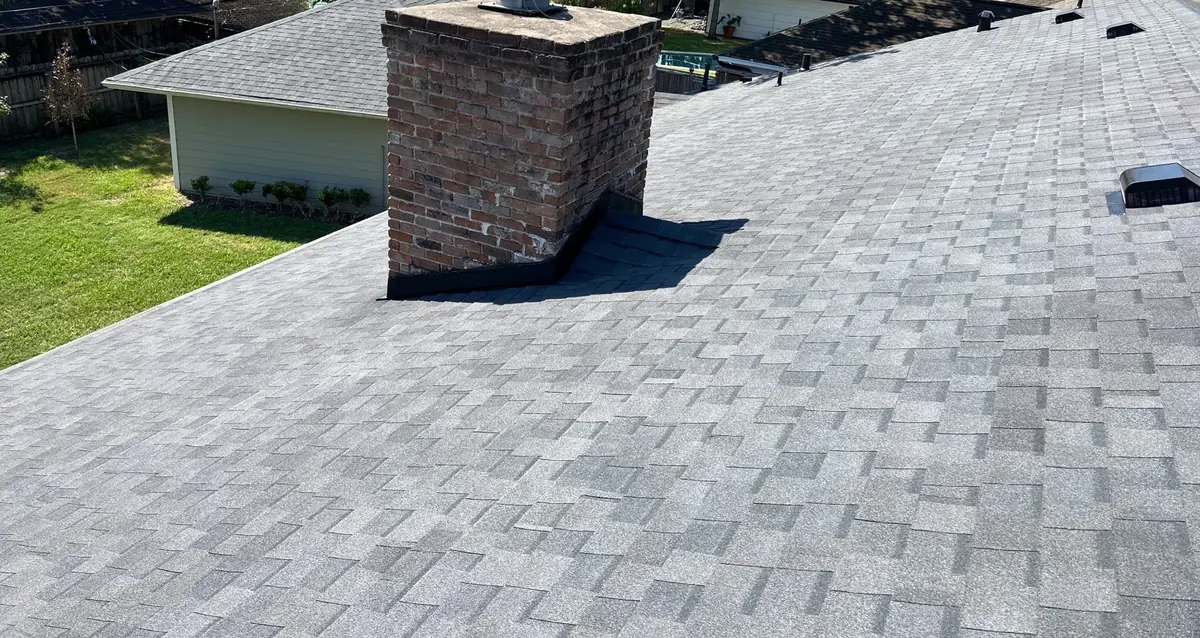 Charcoal laminate roof with dormers on a Memorial-area Houston home in 77024
