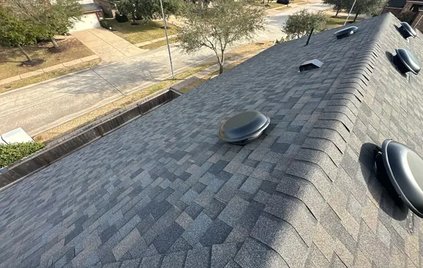 Hip caps and shingle field of the completed roof, Tomball 77377