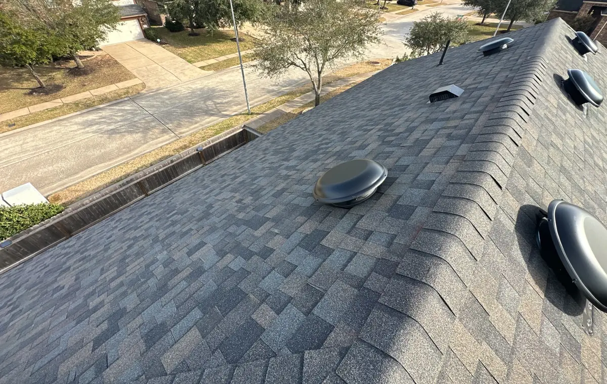Hip caps and shingle field of the completed roof, Tomball 77377