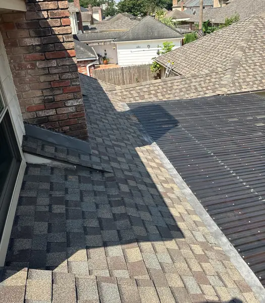 Rebuilt step and counter flashing at the brick chimney, Katy