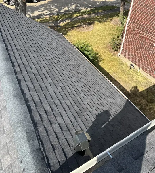 Rear elevation of a January 2025 roof replacement in Sugar Land