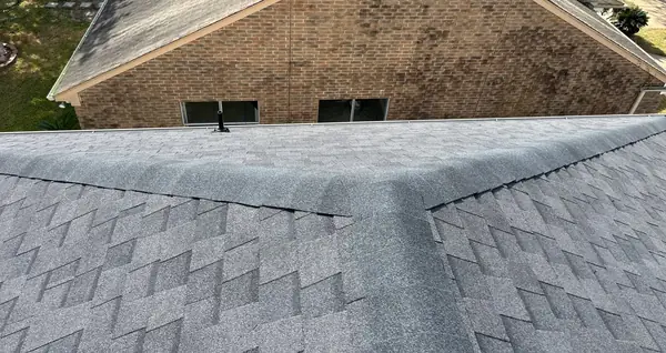 Chimney counter flashing re-cut on a Sugar Land roof