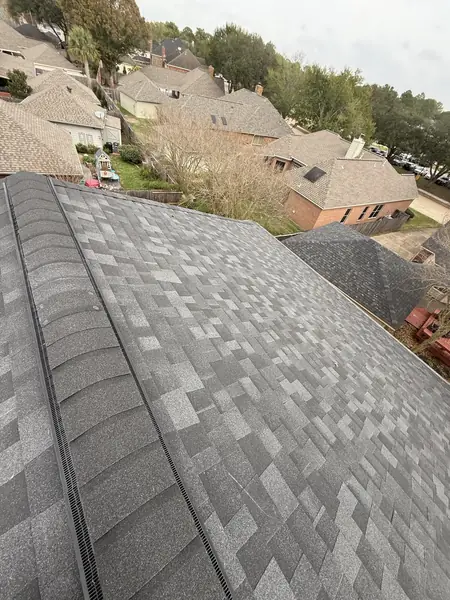 Ridge vent run down the main slope of a new Houston roof