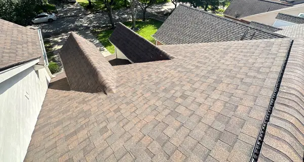 Heather Blend laminate roof with capped hips on a Houston home in 77040