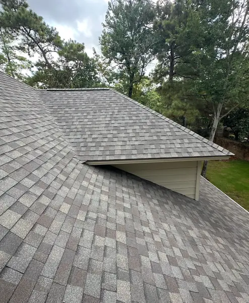 Completed roof and rear gable on a wooded Kingwood lot