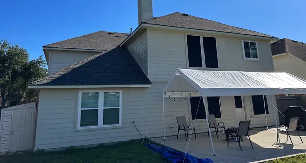Two-story Pearland home in 77581 with a windstorm-certified driftwood roof