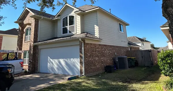 Garage side of a replaced roof in Pearland, TX