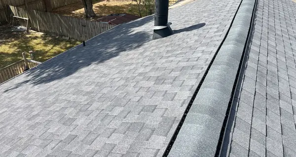 Driftwood laminate roof over new decking on a one-story Houston home in 77081