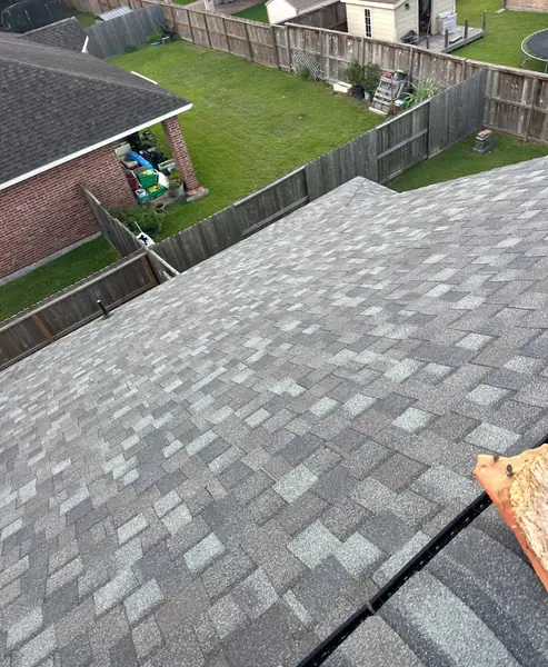 Hip ridge of a June 2026 roof replacement in Pearland, TX