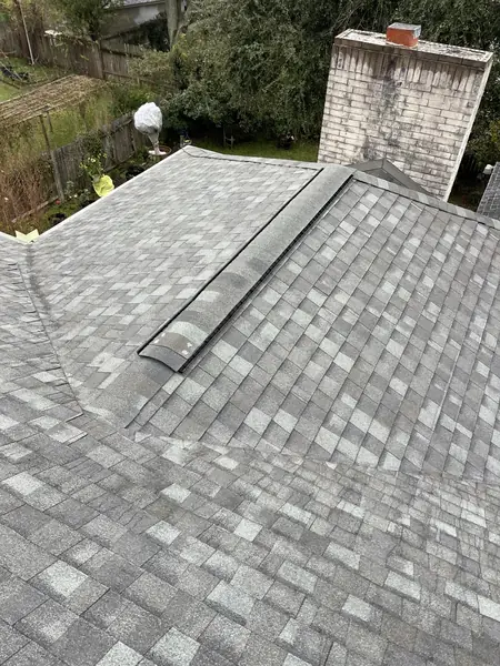 Brick chimney re-flashed on a new Sugar Land roof
