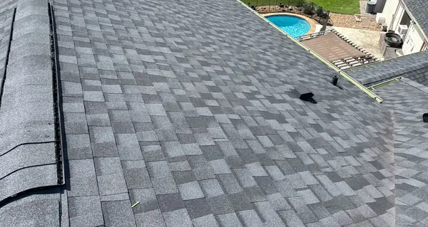 Ridge cap detail on a black shingle roof in Pearland