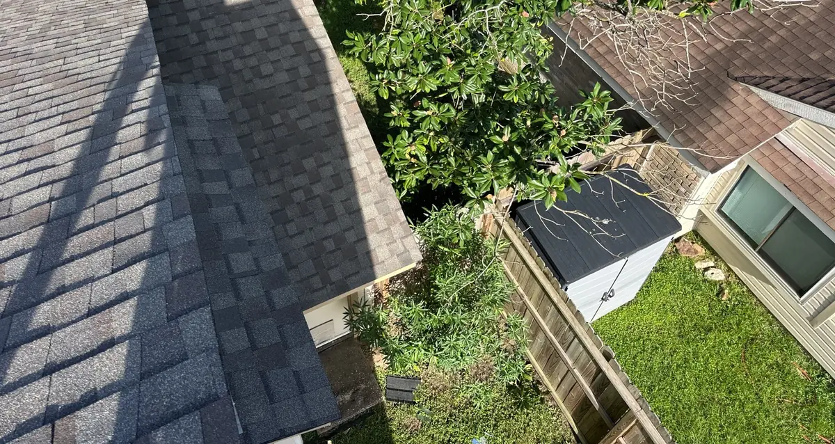 Chimney with new flashing on a charcoal roof in Cypress