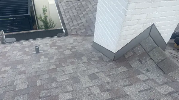 Chimney flashing on a new Weatherwood roof in Houston