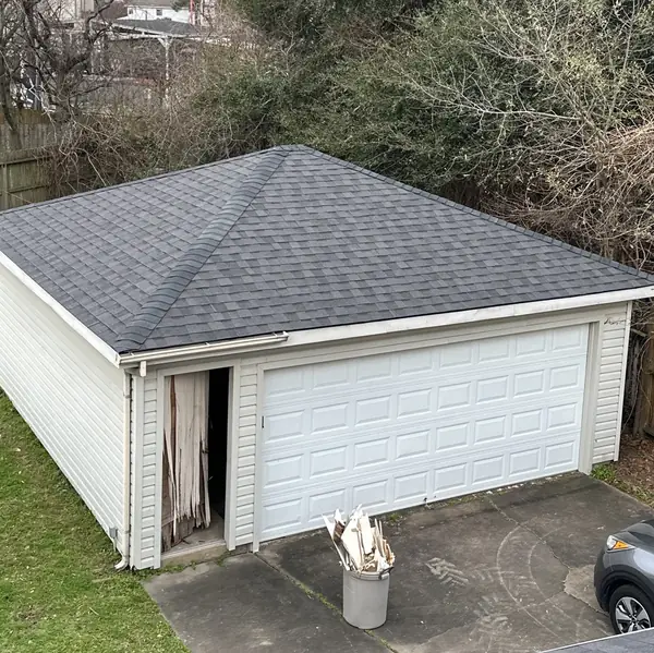 Chimney re-flashed on a March 2025 Houston roof replacement