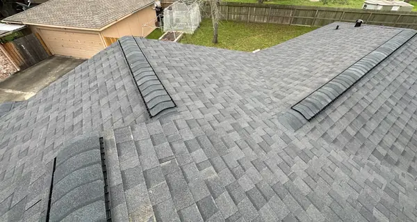 Hip ridge of a new shingle roof in Houston