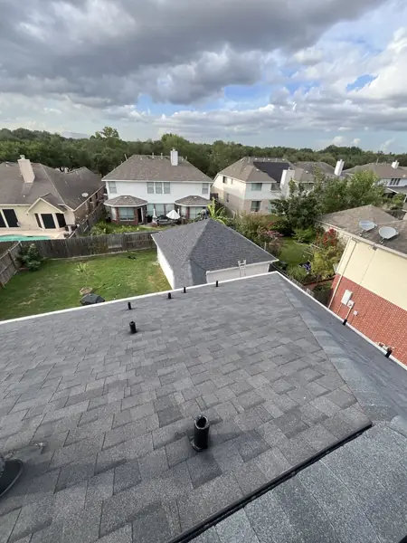 Replaced charcoal roof with new vents on a two-story Houston home in 77041