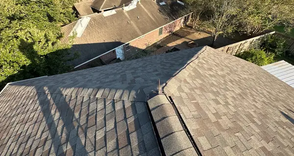 Hip and valley lines on the completed gray-brown roof