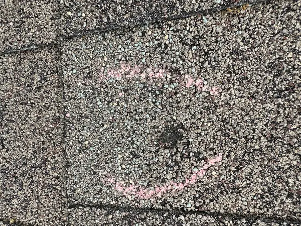 Chalk-circled hail strike on the old roof during the inspection
