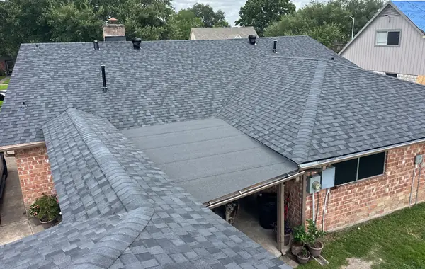 Gray shingle roof with a low-slope rear section in southeast Houston