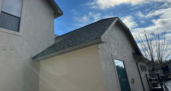 Upper gable with new flashing at the stucco wall