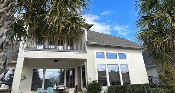 Rear of the house with the balcony under the new roof