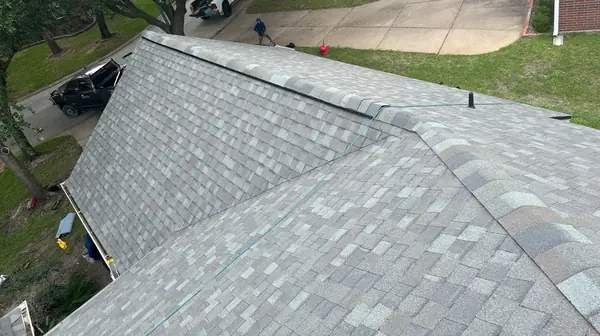 Weathered-gray laminate roof on a one-story Houston home in 77040