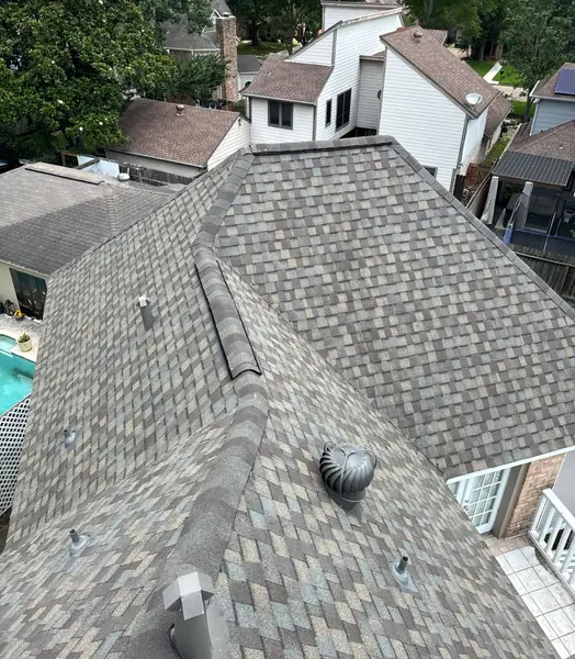 Re-flashed brick chimney and turbine vent above the backyard pool