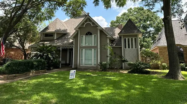 Front of the two-story brick home with the finished roof