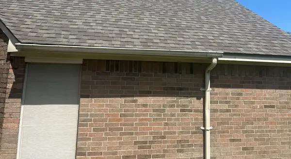 Side elevation with a replaced roof and fresh drip edge