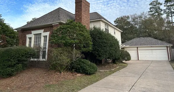 Driftwood laminate roof on a two-story Kingwood home in 77345
