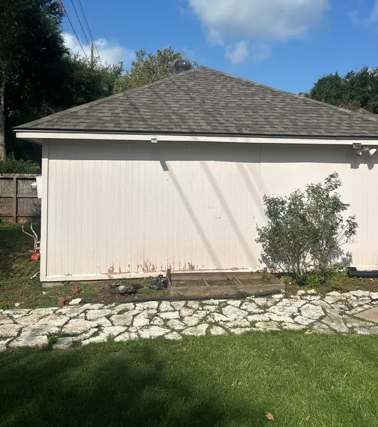 Brick chimney re-flashed on a new Sugar Land, TX roof