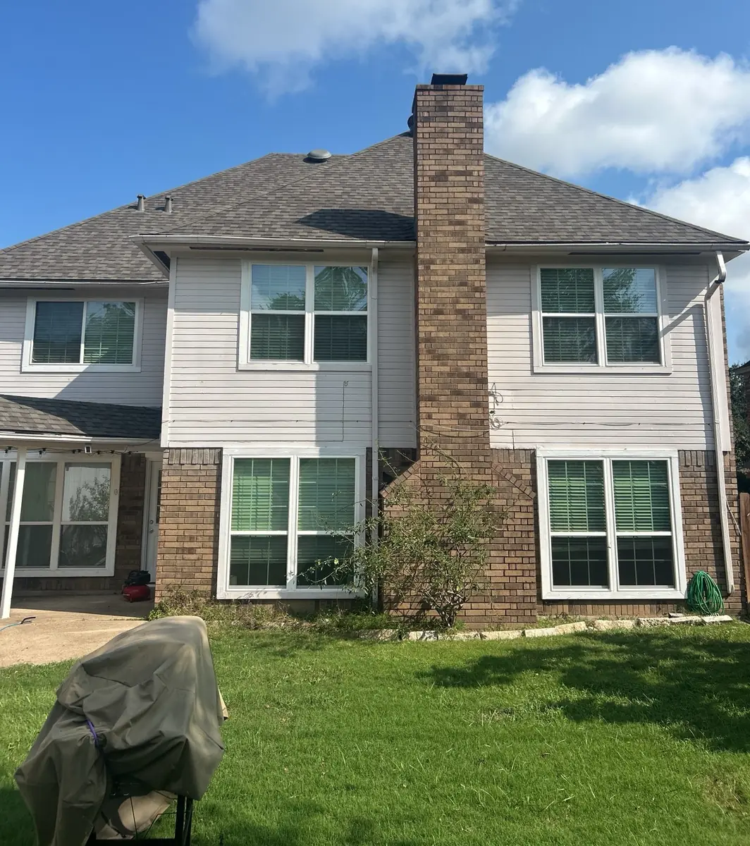 Two-story Sugar Land home in 77479 with a new charcoal laminate roof