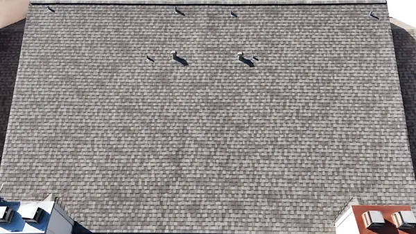 Decking exposed after a three-layer tear-off in Houston