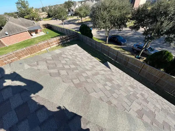Hip ridge of a February 2025 roof replacement in Rosharon
