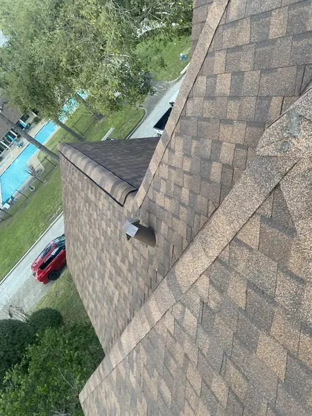 Driftwood laminate roof on a steep two-story home in Houston 77088