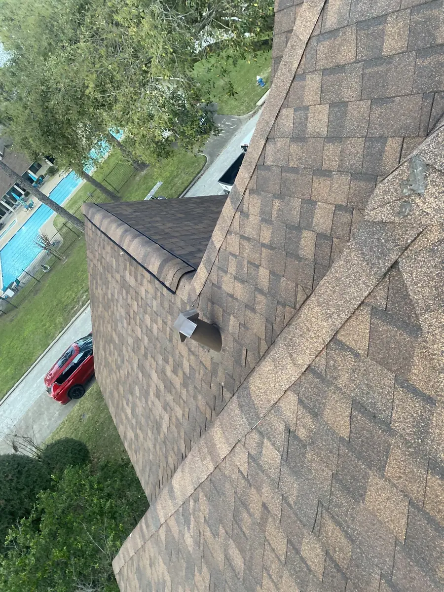 Driftwood laminate roof on a steep two-story home in Houston 77088