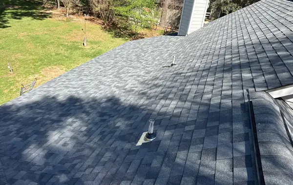 Hip ridge of an April 2026 roof replacement in Hockley, TX