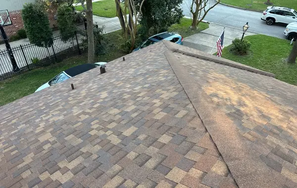 Brick chimney re-flashed on a replaced roof in Houston, TX