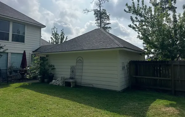 Detached garage re-roofed to match the house
