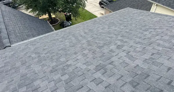 Hip ridge of a new shingle roof in Houston 77073