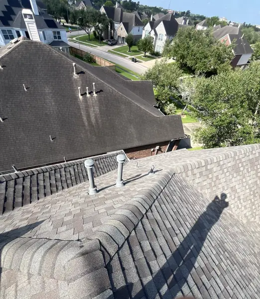 Two-story Sugar Land home in 77479 with a new CertainTeed roof after storm damage