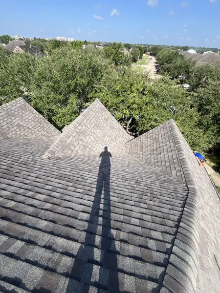 Ridge cap and valley detail on a 5-Star warranty roof
