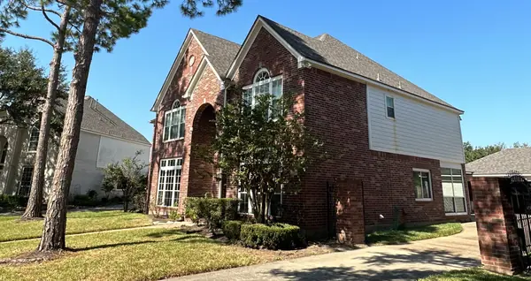 Two-story Pearland home in 77584 with a windstorm-certified driftwood roof