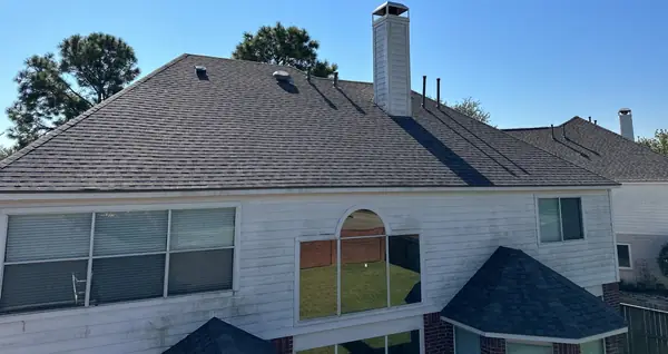 Rear elevation with a new laminate roof in Pearland, TX