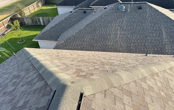 Ridge line of the completed roof above the back yard