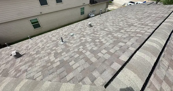 Hip and ridge caps of the new roof from above, Tomball 77375