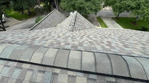 Driftwood laminate roof with new ridge cap on a two-story Houston home in 77040